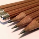 Close-up of sharpened brown Graf von Faber-Castell No.III desk pencils with metal caps
