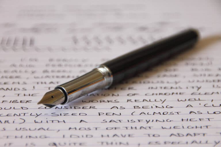 Sheaffer Intensity Carbon fountain pen with black barrel and silver nib on handwritten paper
