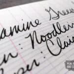 Close-up of handwritten text using Diamine Green/Black fountain pen ink on lined paper
