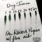 Diamine Green Black ink swatches on Rhodia paper showing drying times and flex nib writing