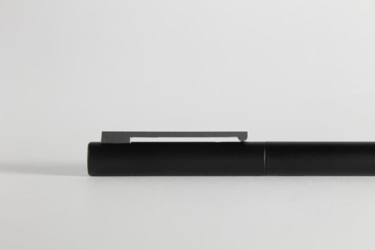 Lamy CP1 fountain pen black cap with distinctive silver clip on white background