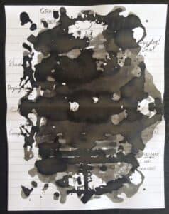 Graf Von Faber-Castell Stone Grey ink swatch with heavy ink blotting on lined paper