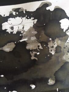 Graf Von Faber-Castell Stone Grey ink swatch showing dark grey and black shading on paper