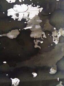 Graf Von Faber-Castell Stone Grey ink swatch showing dark grey and black tones with ink pooling effects