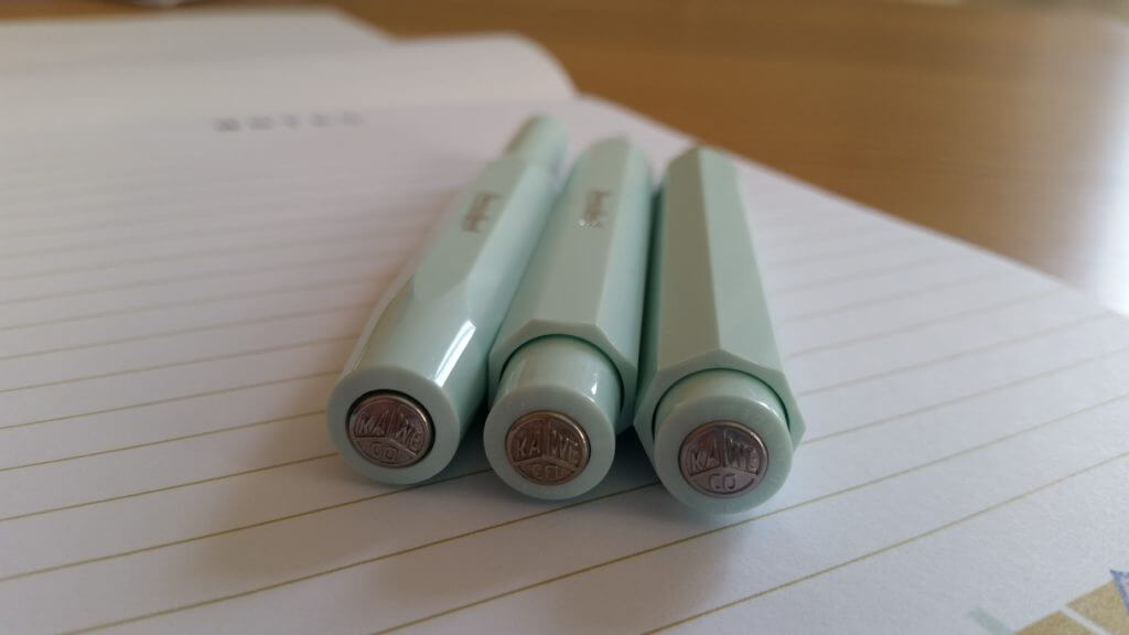 A view of the Kaweco Skyline Sport ballpoint pen, fountain pen and mechanical pencil from behind, with logos on display.