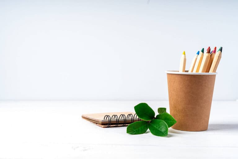 leaf, brown pencil pot and notebook. eco friendly stationery.