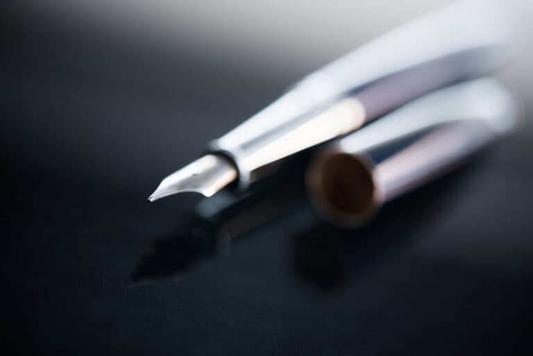A blurry photo of a luxury fountain pen.