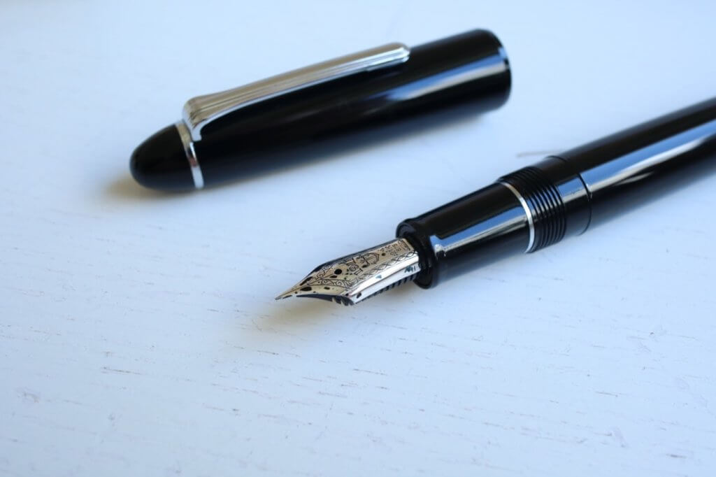 The nib and cap of the Sailor 1911 Ringless fountain pen in Simply Black