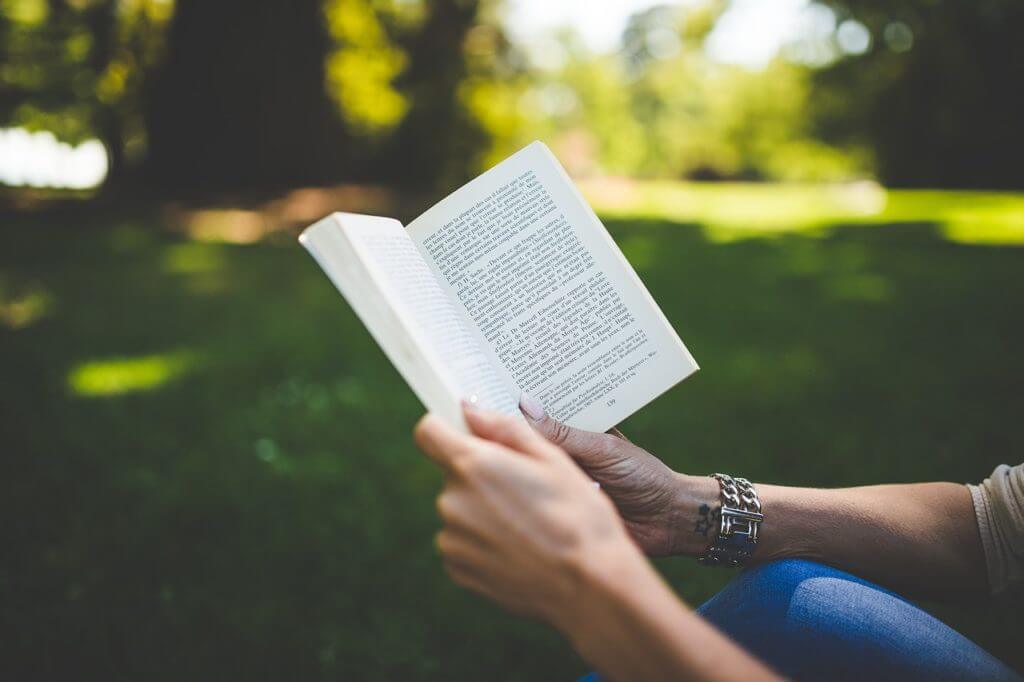 Adult reading a book