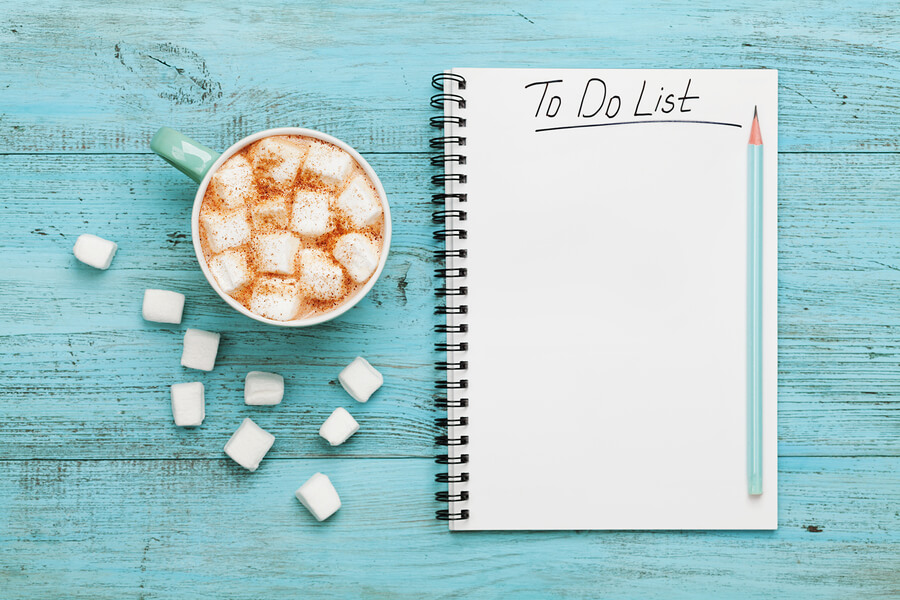 A to-do list with a hot chocolate
