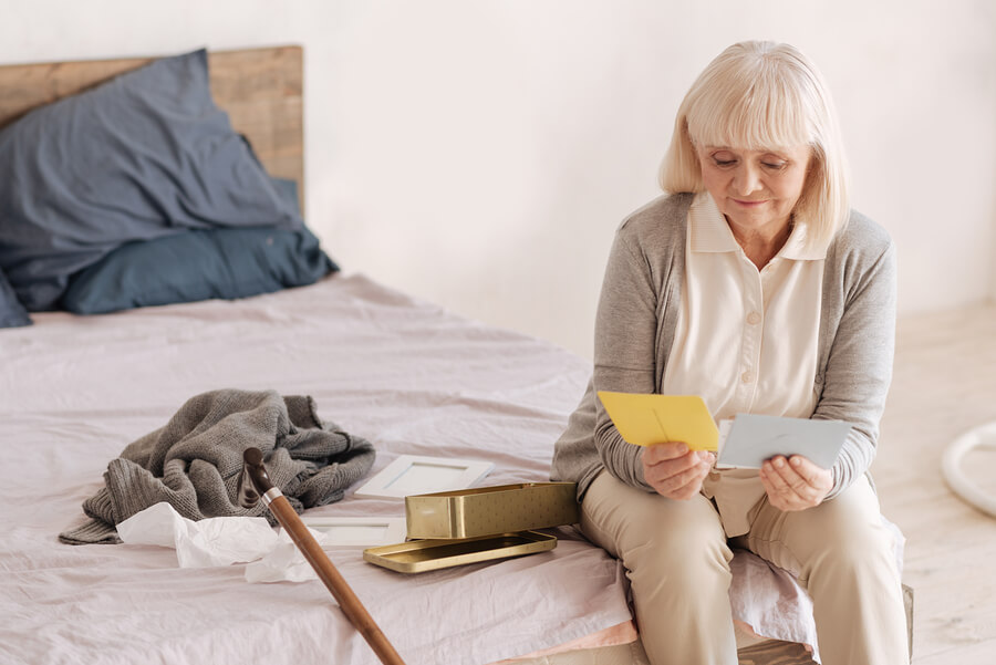 An older lady reading old letters