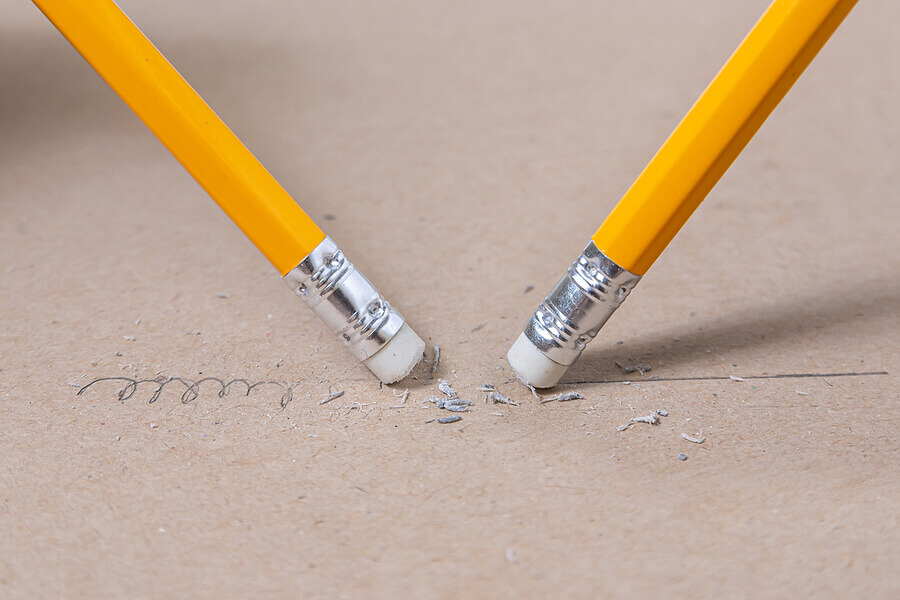 Close up a eraser pencil a straight line and crooked line, Mistake and Unsuccessful concept, Eraser pencil with brow paper