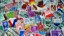 How are British postage stamps designed?