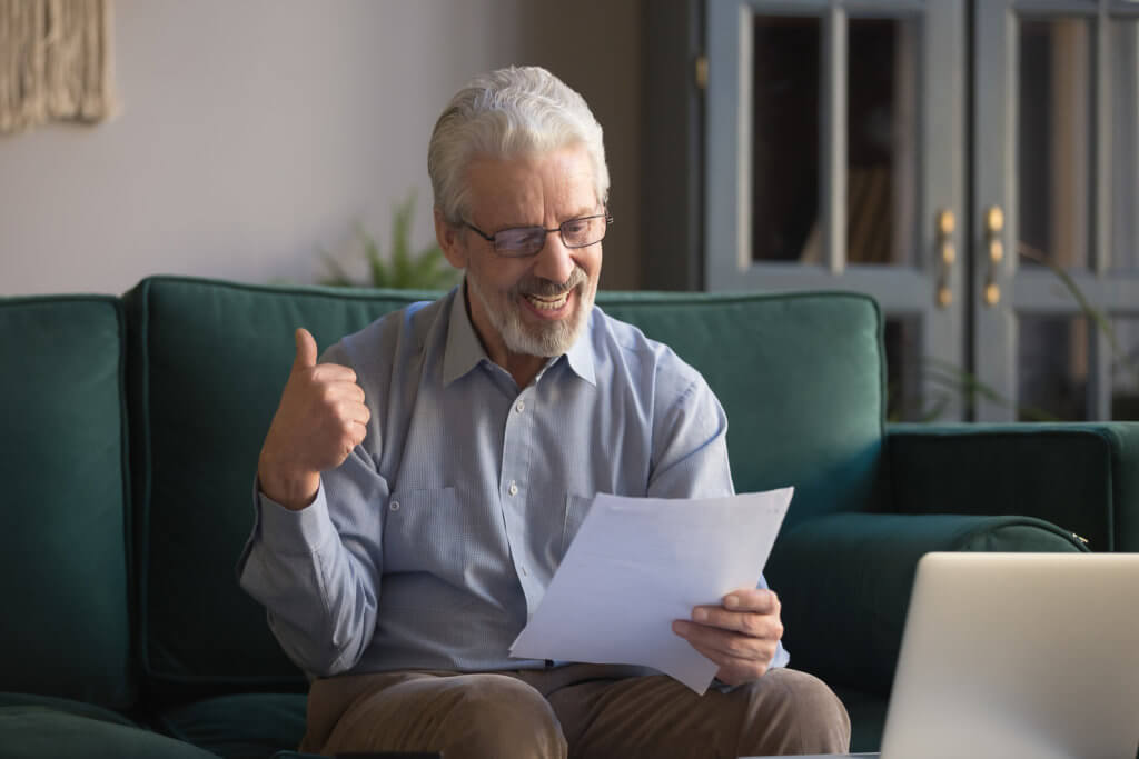 older person reading snail mail