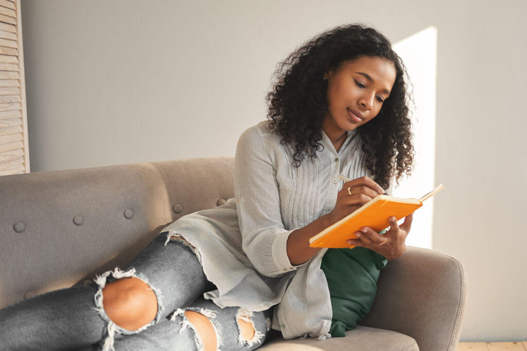 woman using her journal
