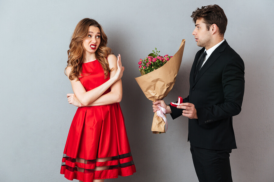 Man proposing and woman saying no