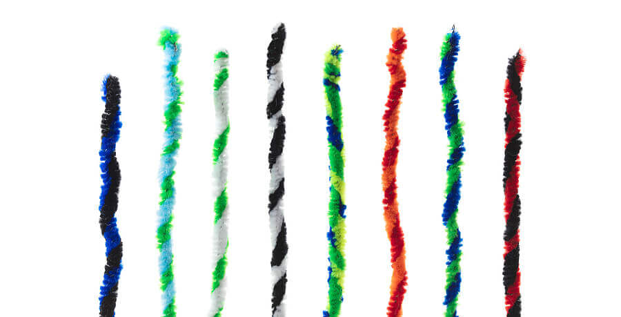 Twisted pipe cleaners in two tone twists, isolated on white, standing up like bar graphs.