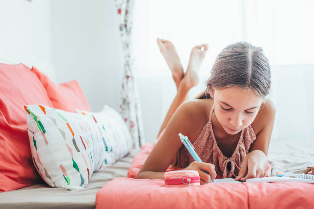 Child writing in a journal