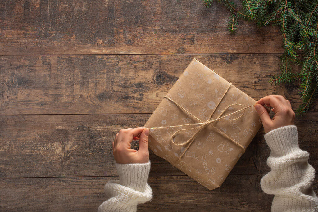 A Christmas gift wrapped in brown paper and string