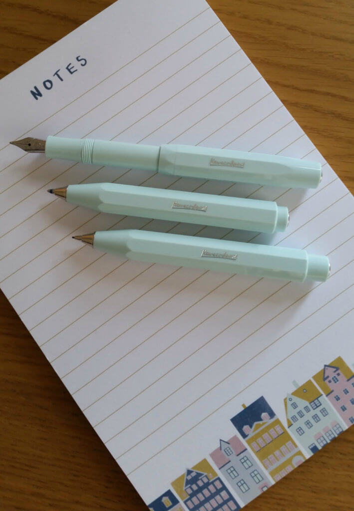 The Kaweco Skyline Sport ballpoint pen, fountain pen and mechanical pencil sat on a notepad