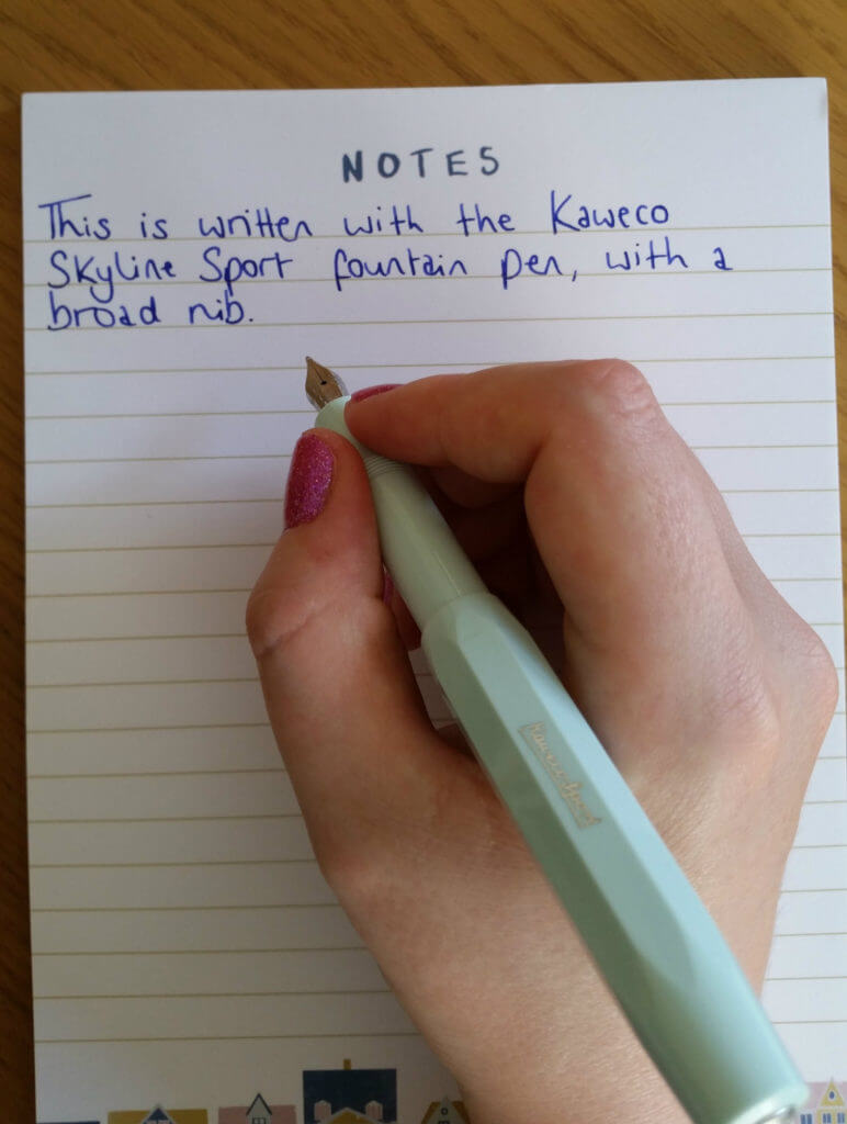The Kaweco Skyline Sport fountain pen in action, writing