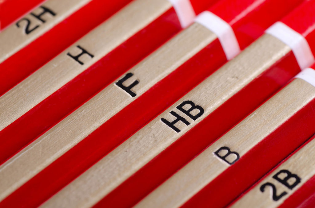 Close up of red pencils stating their lead grades.