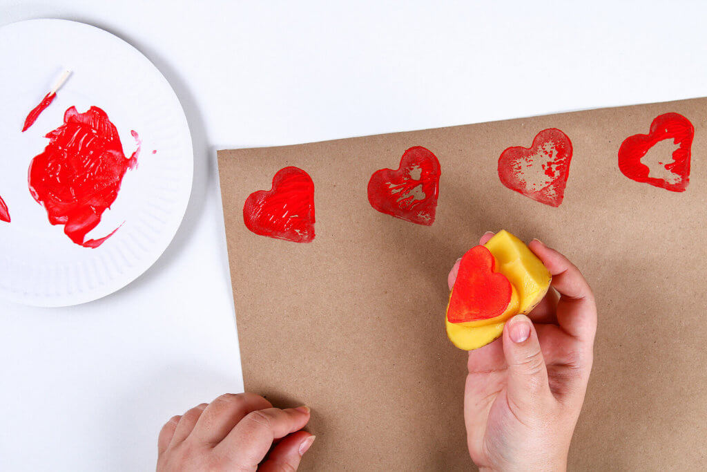 potato stamping with a heart shaped potato